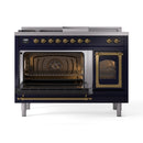 Midnight blue dual-fuel range with brass-trim controls and open left oven door