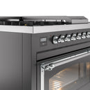 Dual fuel range control panel with round knobs and chrome oven handle, matte graphite