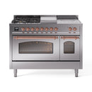 Stainless steel dual-fuel range with copper-trim accents; oven doors open and knobs visible