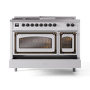 White dual-fuel range with two oven doors open; bronze trim and black burner controls