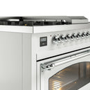 White range control panel with chrome knobs and oven door handle