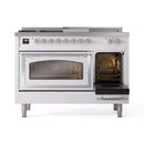 White dual fuel range with left oven open and right door closed, chrome trim