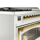 White range control panel with brass knobs and digital display