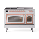 White dual-fuel gas range with twin oven doors and copper-trim handles