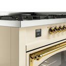 Antique white gas range control panel with brass knobs and digital display