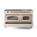 Dual fuel range with brass trim, two glass doors, and four burner cooktop