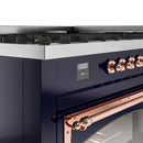 Midnight blue range control panel with copper knobs and digital display