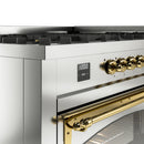 Dual fuel range control panel with brass knobs and digital display