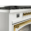 White range control panel with brass knobs and digital display