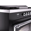 Black range control panel with chrome burner knobs and digital display