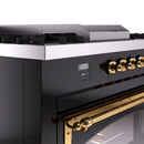ILVE range control panel with brass knobs and digital display on glossy black