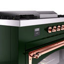 Emerald green range control panel with digital display and copper burner knobs