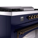Midnight blue oven control panel with digital display and bronze rotary knobs