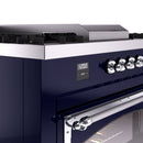 Midnight blue range control panel with knobs, digital display, and chrome handle