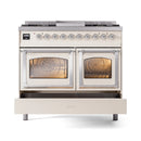 Antique white dual-fuel range with lower drawer open and two glass ovens closed