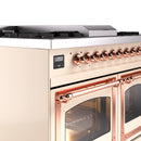 Antique white range front panel with copper control knobs and oven door handles
