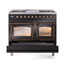 Black dual fuel range with two oven glass doors and bronze trim around handles