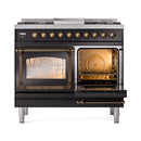 Dual fuel range with one oven open showing racks and one closed glass door