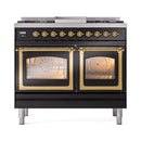 Black dual fuel range with brass-trimmed oven doors and triple glass windows