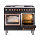 Black dual-fuel range with right oven door open, racks inside, and copper handle trim
