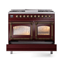 Burgundy dual fuel range with bronze handles and two glass oven doors