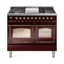 Burgundy dual fuel gas range with bronze trim, twin oven doors with glass windows