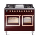 Burgundy dual fuel range with copper-trimmed oven doors and gas burner cooktop