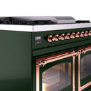 Close-up of emerald green dual fuel range control knobs with copper trim and vented handle