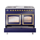 Midnight blue range with brass-trimmed oven windows, gold knob row, and front panel display