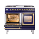 Midnight blue dual fuel range with brass-trim ovens; left door open, right glass door closed