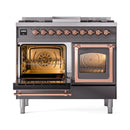 Matte graphite range with right oven door open, left oven door open, copper trim visible