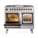 Dual-oven range with one oven door open and bronze-trim rails, showing interior airflow grates