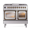 Stainless steel dual-fuel range with two ovens and triple-glass doors, bronze accents