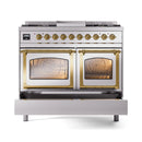 Stainless steel dual oven range with brass trim, both oven doors open and racks inside