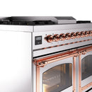 Copper-trimmed control bar and knobs on a stainless steel range