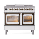 White dual-fuel gas range with two ovens and bronze trim, front view with closed doors