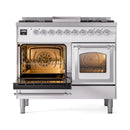 White dual-fuel gas range with left oven open and right oven closed, triple-glass door