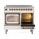 Antique white induction range with bronze-trim double doors; one door open showing bake