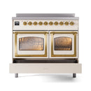 Antique white induction range with triple glass oven doors and brass-trimmed handles