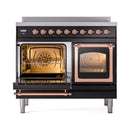 Glossy black induction range with oven door open, copper interior light, and racks