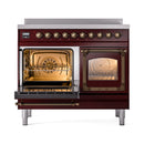 Burgundy induction range with bronze trim, open doors showing two oven interiors