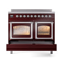 Burgundy induction range with triple glass oven doors, chrome trim, and knob controls.