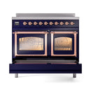 Midnight blue induction range with both oven doors closed, copper trim and control knobs
