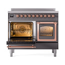Matte graphite induction range with triple glass doors open, copper trim, two ovens