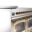 Brass-trim oven door handle and stainless control panel with digital display