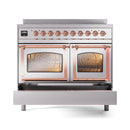 Stainless steel induction range with copper-trim dual oven doors, open interior and racks