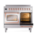 Stainless steel induction range with copper-trim oven doors, one side open with baking rack