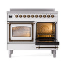 White induction range with bronze knobs and one oven door open