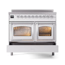 White induction range with chrome trim, both oven doors open with warm interior lighting