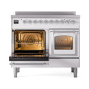 White ILVE range with chrome trim, open ovens showing racks and warm interior light